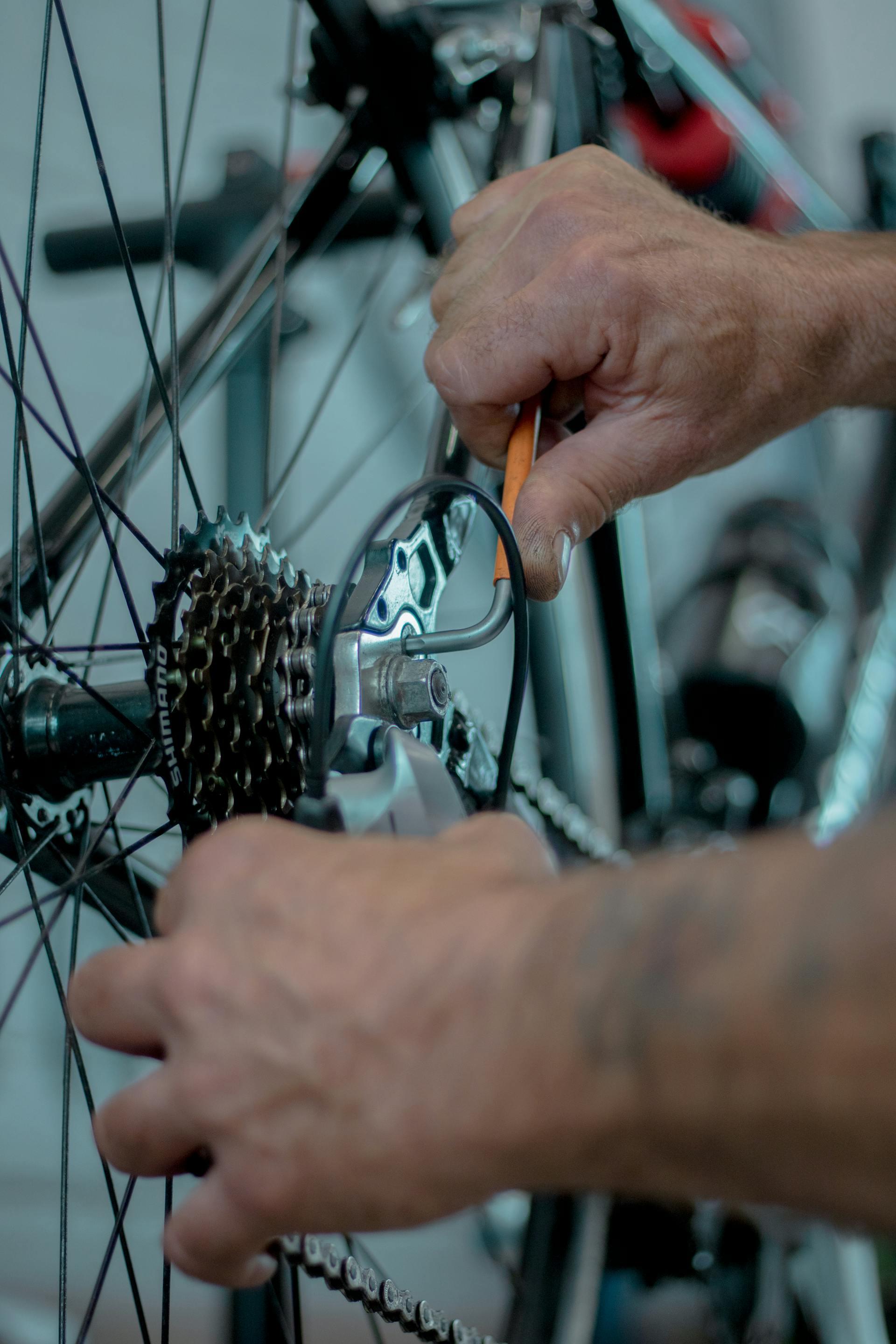 Cyclist repairing bicycle